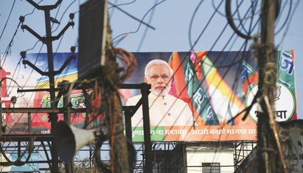 A Bharatiya Janata Party (BJP) election campaign hoarding displays an image of Prime Minister Narendra Modi in Varanasi.