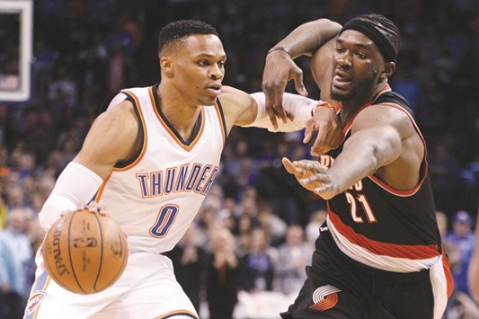 Oklahoma City Thunder guard Russell Westbrook (L) drives to the basket in front of Portland Trail Blazers forward Noah Vonleh during the first quarter at Chesapeake Energy Arena. PICTURE: USA TODAY Sports