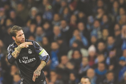 Real Madridu2019s defender Sergio Ramos celebrates after scoring during the UEFA Champions League match against SSC Napoli at the San Paolo stadium in Naples.