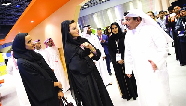 HH Sheikha Moza and HE Sheikha Hind interact with HE the Minister of Transport and Communication Jassim Seif Ahmed al-Sulaiti at Qitcom yesterday. PICTURES: AR Al-Baker / HHOPL