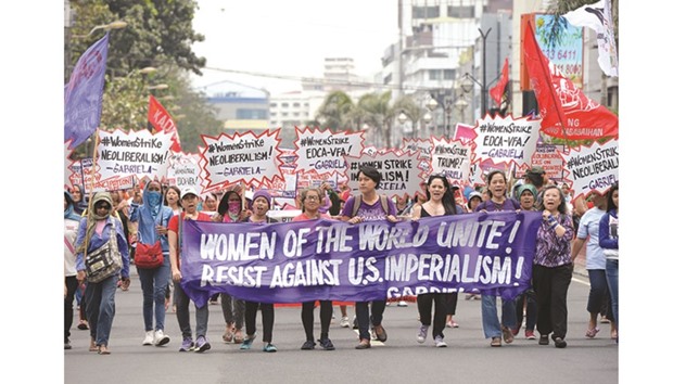 Members of womenu2019s group Gabriela march towards the US embassy during a rally to celebrate International Womenu2019s Day in Manila yesterday.