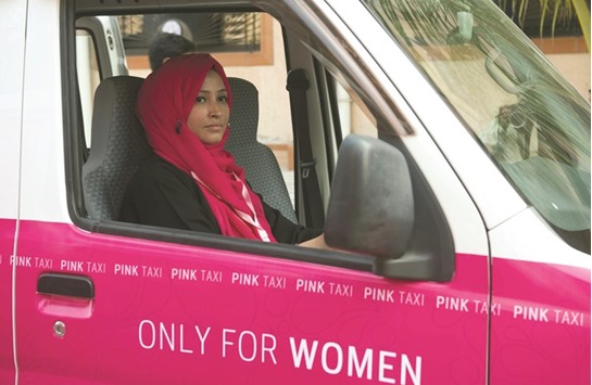A driver with the women-only Paxi Pakistan taxi company sits in a Pink Taxi during a launching ceremony in Karachi on International Womenu2019s Day on Wednesday.