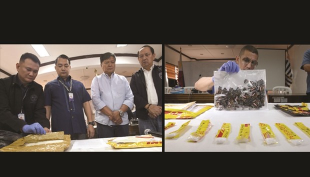 From left: Customs officials Major Jayvee Cometay, deputy commissioner Ariel Nepomuceno, district collector Ed Macabeo and enforcement director Butch Tibayan look at a seized package containing 1.2kg of the illegal drug u201cshabuu201d during a press conference at the Bureau of Customsu2019 office at the Manila airport yesterday. The illegal drugs with a street value of 5.5mn pesos (US$110,000), which were seized on March 2 hidden inside a backpack, along with wigs, will be turned over to the Philippine Drug Enforcement Agency (PDEA) to be destroyed. The Bureau of Customs has tightened its enforcement initiatives, as part of President Rodrigo Duterteu2019s war on drugs. Right: A customs police officer shows a package containing the illegal drug u201cshabuu201d hidden in candy wrappers.