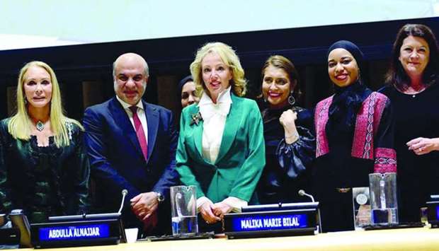 Al Jazeera's Abdulla al-Najjar, Malika Bilal and Patty Culhane are seen with dignitaries at the award ceremony in New York.