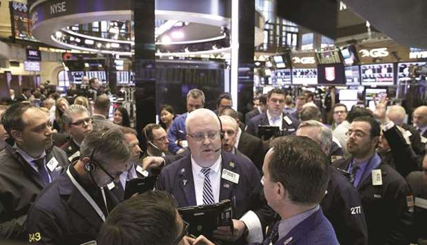 Traders work on the floor of the New York Stock Exchange (file). President Donald Trumpu2019s announcement of import tariffs, and the prospect of retaliation by other countries, is prompting some fund managers to pare their holdings of US stocks and look for opportunities overseas.