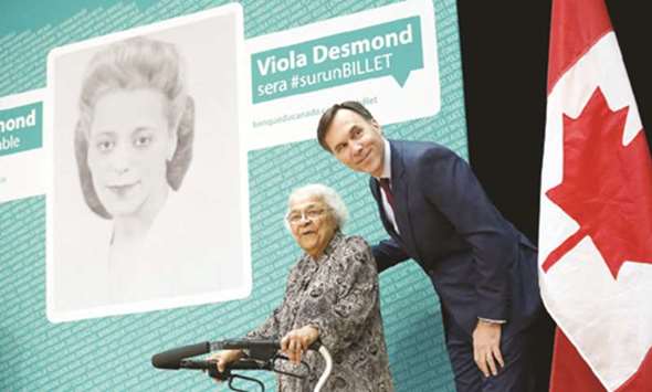 Canadau2019s Finance Minister Bill Morneau with Wanda Robson after her sister Viola Desmond was chosen to feature on the $10 banknote.
