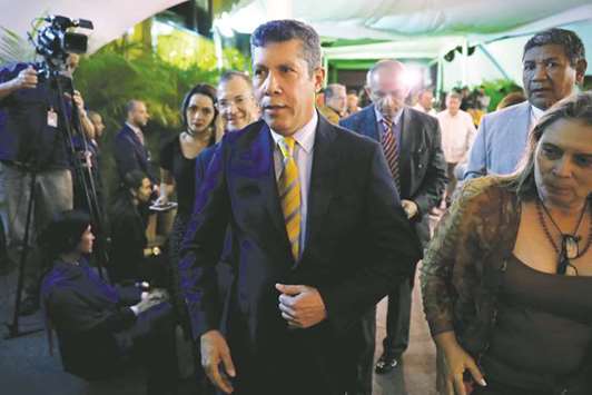 Venezuelan opposition presidential candidate Henri Falcon (centre) leaves after registering his candidacy for president at the National Electoral Council (CNE) headquarters in Caracas, Venezuela.
