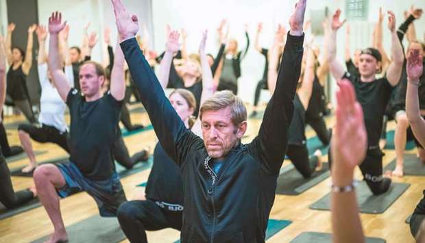 Bjoern Borg sportswear brand CEO Henrik Bunge (centre) joins his staff for a yoga class in Stockholm.