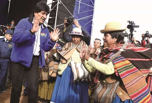 Bolivian President Evo Morales takes part in a traditional Andean ceremony in Caracollo yesterday during the unfolding of a huge 200km flag u2014 called the u2018Banderazou2019 (big flagging) u2014 linking La Paz with Oruro, to symbolically mark the maritime lawsuit against Chile, which starts next March 19 at the Permanent Court of International Justice in The Hague.