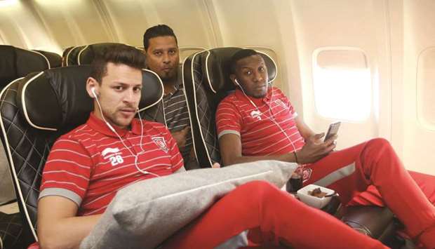 Duhail captain Youssef Msakni and Mohamed Musa settle down on their flight to Tashkent yesterday. The team arrived to a warm welcome in the Uzbek capital a few hours later.