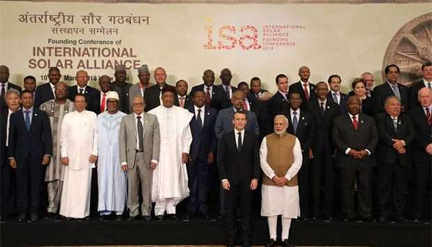Indian Prime Minister Narendra Modi and French President Emmanuel Macron pose with world leaders and representatives at the start of the founding conference of the International Solar Alliance in New Delhi on Sunday.