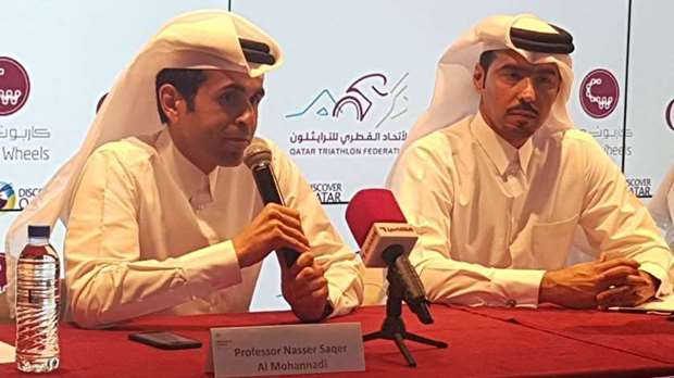 Qatar Cycling and Triathlon Federation board member Dr Nasser al-Mohannadi addresses the media as president Dr Mohamed al-Kuwari (right) looks on.