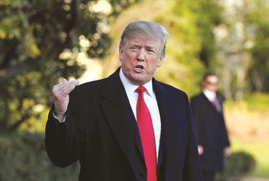 President Donald Trump answers questions from the media as he departs the White House toward Marine One in Washington, DC yesterday.