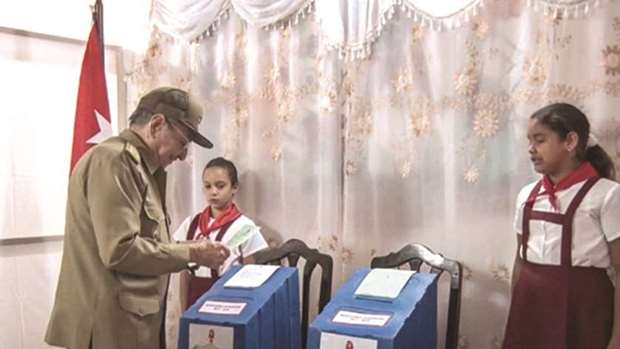 Cuban President Raul Castro casts his vote at a polling station in Santiago de Cuba Province yesterday.