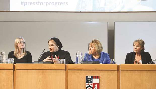 Dr Sheikha Aisha bint Faleh al-Thani speaks at the event as others look on.