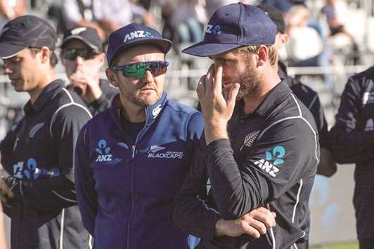 New Zealandu2019s head coach Mike Hesson (centre) and captain Kane Williamson. (AFP)