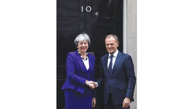Prime Minister Theresa May greets European Council president Donald Tusk outside 10 Downing Street in London yesterday.