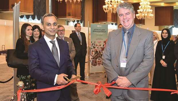 British ambassador Ajay Sharma opens the exhibition yesterday as British Council Qatar director Dr Frank Fitzpatrick and other officials look on.