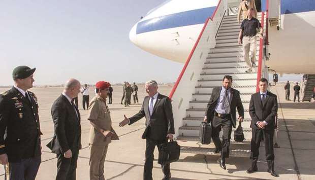 US Secretary for Defence Jim Mattis prepares to shake hands with an Omani military official as he is greeted by US Ambassador to Oman March Sievers (second left) upon his arrival in the capital Muscat, yesterday.