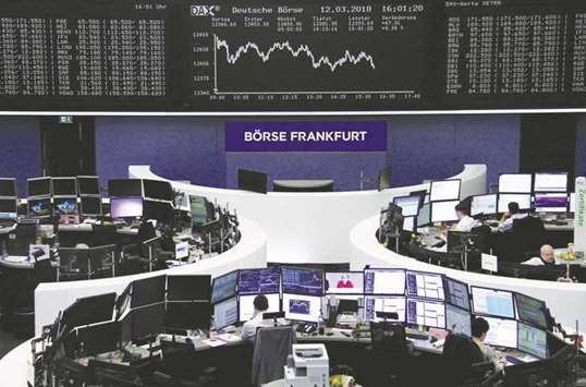Traders are seen at the Frankfurt Stock Exchange. The DAX 30 outperformed its peers and gained 0.6% to 12,418.39 after energy giant E.ON announced plans to take over Innogy in a deal valued at around u20ac20bn.