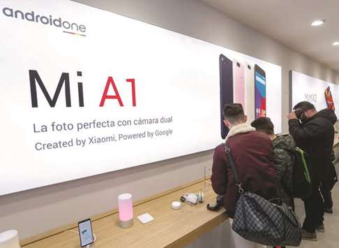 Customers look at products at a Xiaomi shop in Barcelona. The Chinese smartphone maker grew rapidly after it launched its first smartphone in 2011, becoming the biggest vendor in China just three years later, although it has since slipped down the rankings.