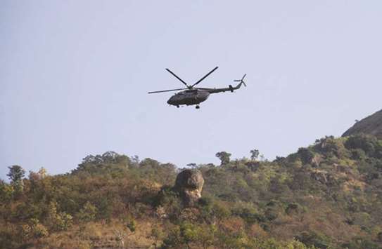 An Indian Air Force helicopter patrols during a rescue mission at Kurangani Hill in Theni district of Tamil Nadu yesterday.