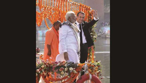 French President Emmanuel Macron and Prime Minister Narendra Modi arrive by boat to a u2018ghatu2019 during a visit to Varanasi yesterday.