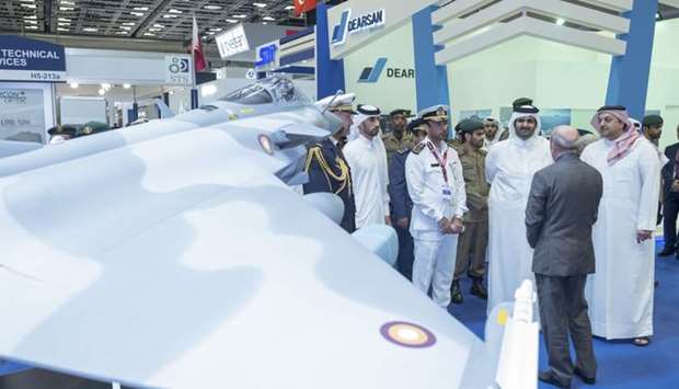 His Highness the Deputy Emir Sheikh Abdullah bin Hamad al-Thani and HE the Deputy Prime Minister and Minister of State Defence Affairs Dr Khalid bin Mohamed al-Attiyah are briefed on the maritime and military defence equipment at Dimdex 2018 which opened in Doha.