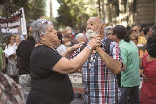 An old couple dance as they take part in a protest against the government demanding better pensions at Santiago, Chile, yesterday.