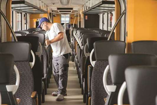 An employee inspects passenger seating inside a Alstom Coradia Lint railway train during final quality checks inside the Alstom factory in Salzgitter. The Purchasing Managersu2019 Index for manufacturing in the eurozone fell for a second month in February, and its decline since the end of 2017 has been the steepest in two years.