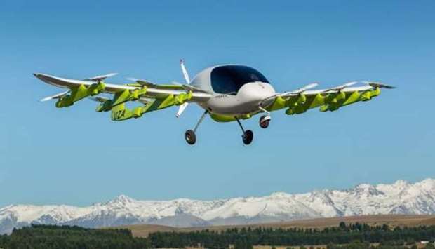 The electric aircraft rises into the air like a helicopter.