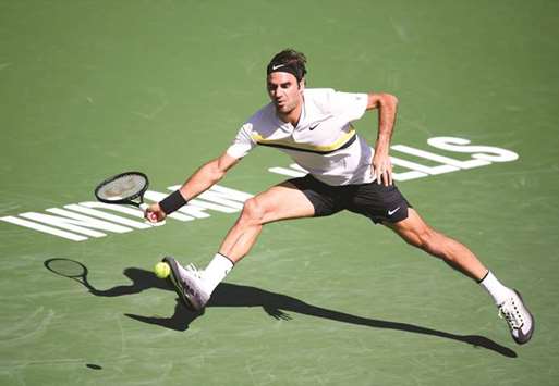 Roger Federer of Switzerland attempts a running forehand in his match against Filip Krajinovic of Serbia during the BNP Paribas Open at the Indian Wells Tennis Garden in Indian Wells, California. (Getty Images/AFP)