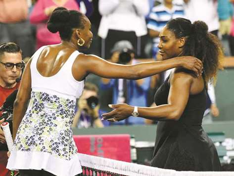 Venus Williams and Serena Williams hug after their third round match in the BNP Paribas Open at the Indian Wells Tennis Garden. Venus won the match. PICTURE: USA TODAY Sports