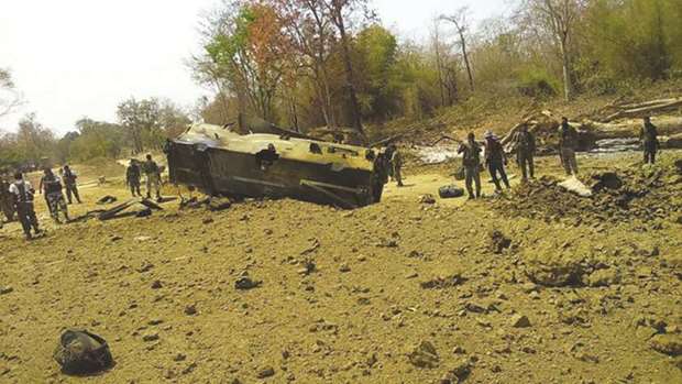 Security officers inspect the wreckage of the anti-landmine vehicle which was blown up by Maoists in Sukma district yesterday.