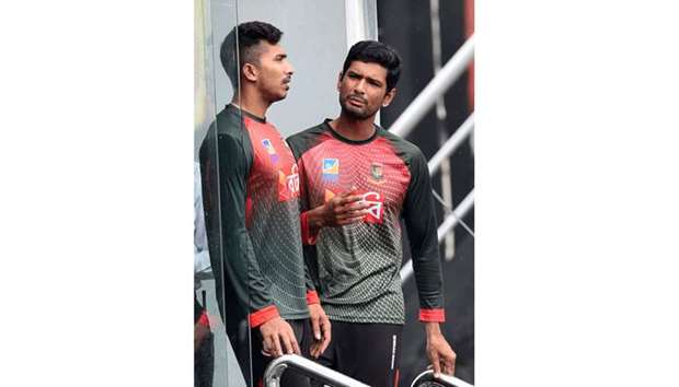 Bangladesh captain Mohammed Mahmudullah (right) with teammate Soumya Sarkar in the dressing room after rain delayed a training session at the R Premadasa stadium in Colombo yesterday. (AFP)