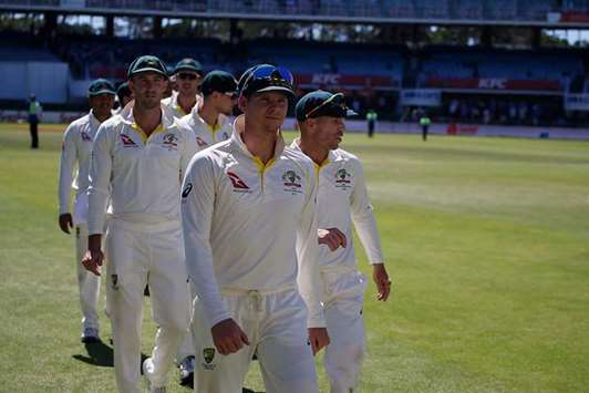  Australiau2019s captain Steve Smith leads his team including David Warner (right) off the field after their defeat on the fourth day of the second Test against South Africa at St Georgeu2019s Park in Port Elizabeth on Monday. (AFP)
