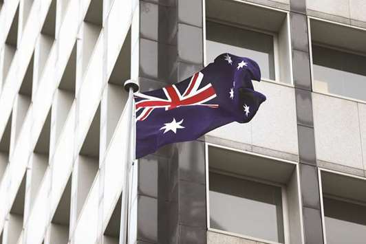 The Australian flag flies outside the Reserve Bank of Australia headquarters in Sydney. Australia has a substantial number of Islamic finance service providers which offer a broad scope of Shariah-compliant finance products  ranging from house financing, Islamic pensions, wealth management to halal superannuation funds and takaful.