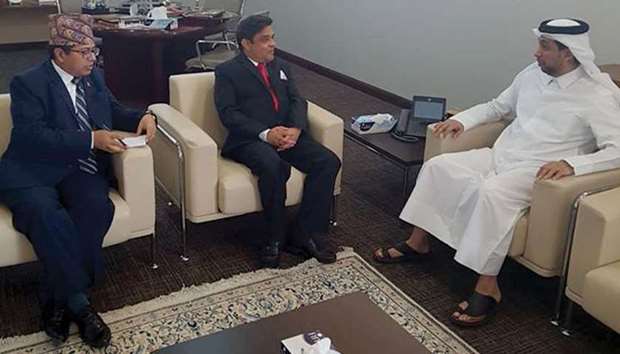 MEETING: President of Qatar University, right, with Nepali ambassador, centre.