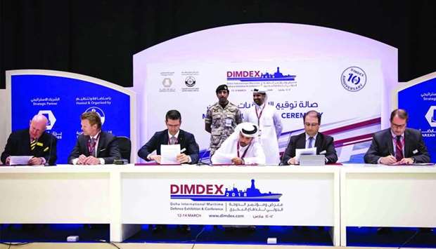 Dignitaries from Barzan Holdings during a signing ceremony with its international partners at Dimdex 2018