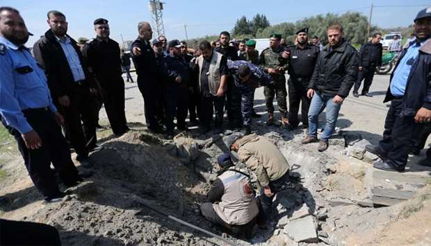 Hamas police chief Tayseer al-Batish inspects the site of an explosion that targeted the convoy of Palestinian Prime Minister Rami Hamdallah, in the northern Gaza Strip