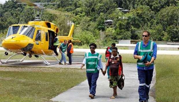 A pregnant woman being evacuated to a medical centre at Moro in Papua New Guinea.