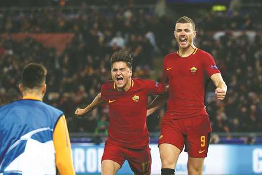 Romau2019s Edin Dzeko (right) celebrates with Cengiz Under after scoring their first goal against Shakhtar Donetsk ih the Champions League match at the Stadio Olimpico in Rome. (Reuters)