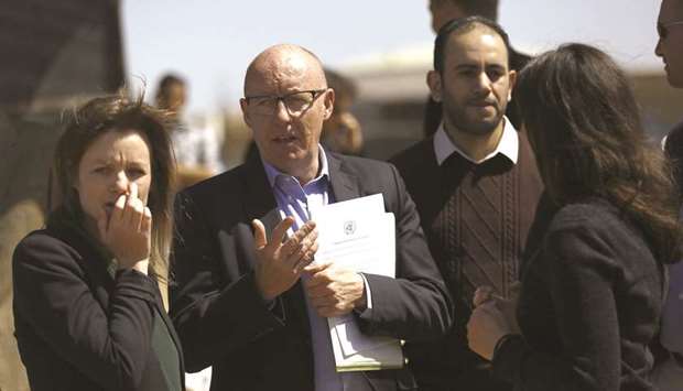 Jamie McGoldrick (centre), humanitarian response co-ordinator, arrives for a press conference in Beit Lahia in the northern Gaza Strip, yesterday.