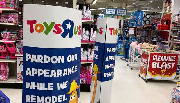 A construction sign is posted inside of a Toys R' Us store in San Rafael