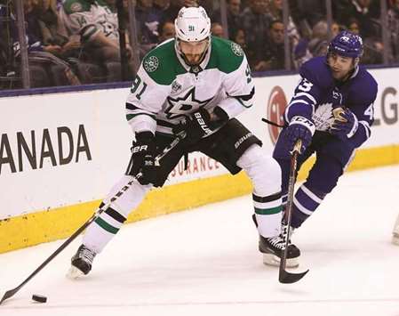 Tyler Seguin of Dallas Stars controls the puck against Nazem Kadri of Maple Leafs. (USA TODAY Sports)