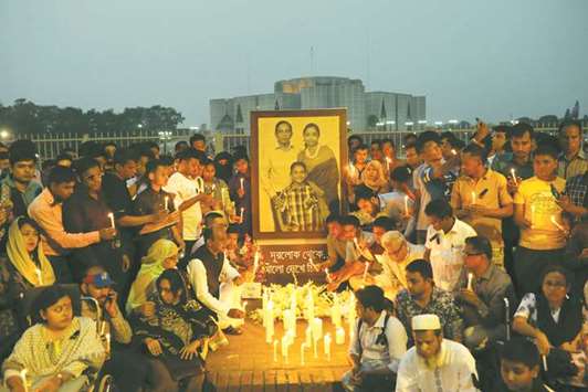 People light candles in Dhaka in memory of the victims of the US-Bangla aircraft crash in Nepal.