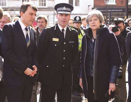 Prime Minister Theresa May visits the city where former Russian intelligence officer Sergei Skripal and his daughter Yulia were poisoned with a nerve agent, in Salisbury yesterday.