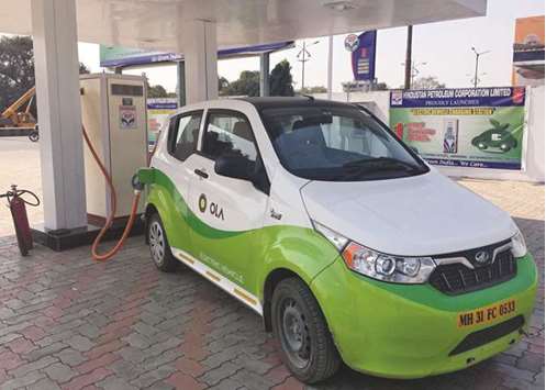 Mahindrau2019s, e2oPlus, operated by Indian ride-hailing company Ola, is seen at an electric vehicle charging station in Nagpur.