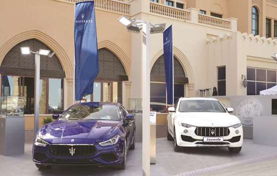 Maserati vehicles on display at the boat show.