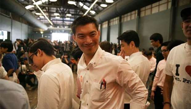 Thanathorn Juangroongruangkit, the founder of Thailand's Future Forward Party, smiles during the launch of the party in Bangkok on Thursday.